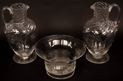 Lot 331 - A pair of glass ewers, 21cm high and a bowl,...