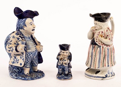 Lot 396 - A Delft figural Toby jug of a toper, 28cm high,...