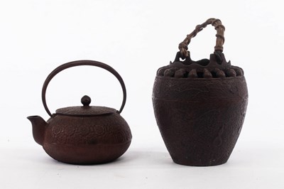 Lot 439 - A Japanese cast iron Ikebana, with swing...