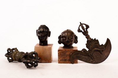 Lot 459 - Two small Tibetan bronze heads, a Tibetan...