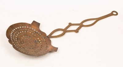 Lot 560 - A 19th Century brass chestnut roaster, 61cm long