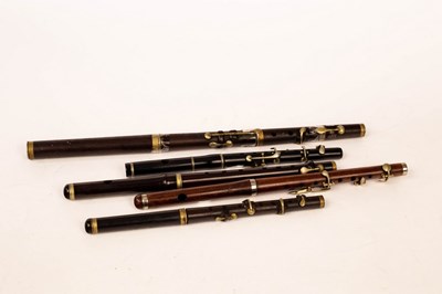 Lot 572 - A rosewood 5-key flute, 38cm long, another...