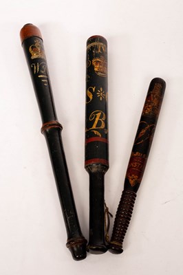 Lot 576 - Two William IV painted truncheons and another...