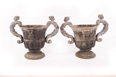 Lot 608 - A pair of two-handled lead urns, 48cm high