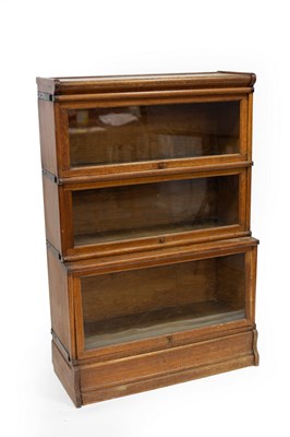 Lot 616 - A Globe Wernicke type oak bookcase, the three...