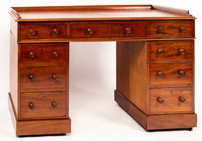 Lot 617 - A mahogany pedestal desk with galleried top,...