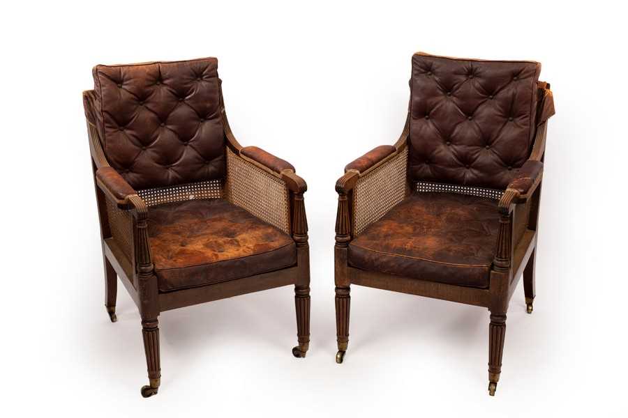 Lot 619 - A pair of William IV mahogany library bergère...