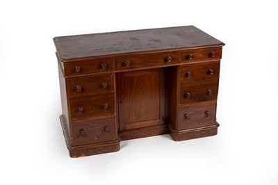 Lot 632 - A mahogany kneehole desk fitted a surround of...