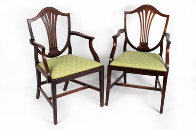 Lot 645 - A pair of mahogany shield back armchairs with...