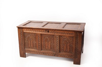 Lot 647 - A 17th Century oak chest, the triple-panel...