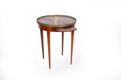 Lot 654 - A French marble top mahogany table with brass...