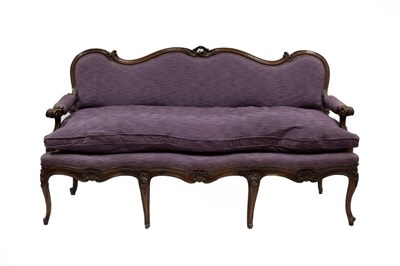 Lot 666 - An Italian walnut sofa with carved and moulded...