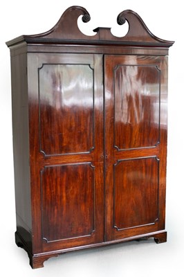 Lot 670 - A George III mahogany cupboard, the broken...