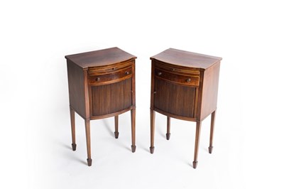 Lot 677 - A pair of Georgian mahogany bowfront bedside...