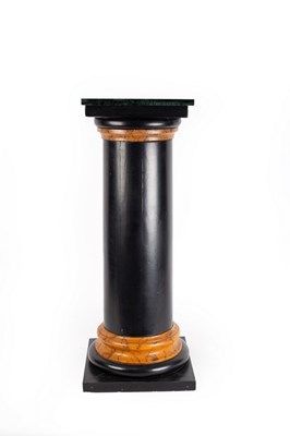 Lot 681 - An ebonised column with faux marble collar and...