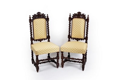 Lot 697 - A pair of 19th Century carved oak hall chairs...