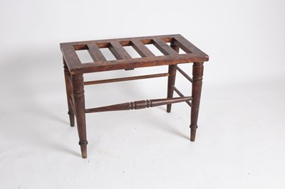 Lot 717 - An Edwardian walnut luggage stand, on turned...