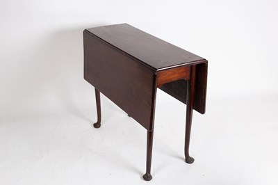 Lot 718 - A Georgian mahogany two-flap table, on turned...