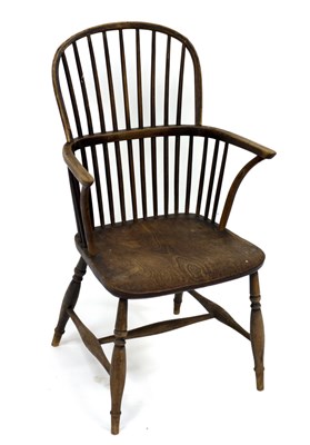 Lot 720 - A Windsor type stick back armchair with dished...