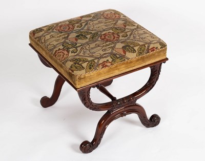 Lot 737 - A Regency style X-framed carved stool, the...