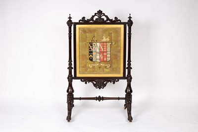 Lot 761 - A Victorian armorial fire screen, the...