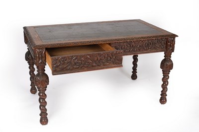 Lot 762 - A Victorian oak writing table with inset...