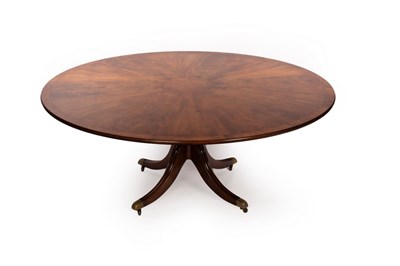 Lot 771 - A bespoke mahogany dining table, the circular...