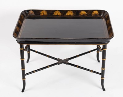 Lot 774 - A black lacquered tray mounted on a later...