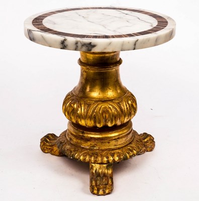 Lot 796 - A low marble top table on carved and gilded...