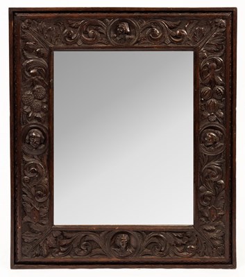 Lot 815 - A 19th Century carved oak mirror, the frame...