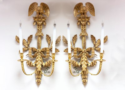 Lot 834 - A pair of Empire style two-branch wall sconces...