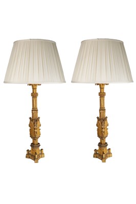 Lot 835 - A pair of Gothic style gilt metal table lamps,...