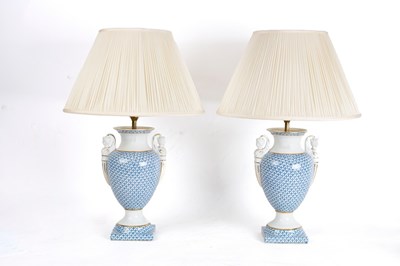 Lot 840 - A pair of porcelain table lamps with blue and...