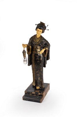 Lot 841 - A table lamp, the bulb supported by a figure...