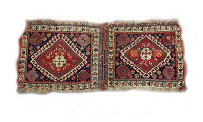 Lot 857 - A Hamadan saddlebag decorated two medallions...