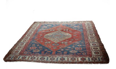 Lot 859 - A bordered and figured Bakshaish carpet with...