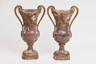 Lot 885 - A pair of mauve veined marble vases of...