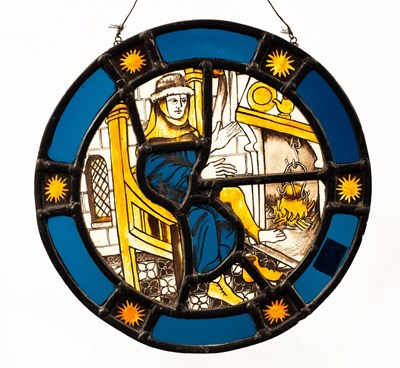 Lot 900 - A medieval style circular stained glass panel...