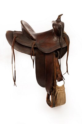 Lot 1040 - A leather Western saddle, J Harpham, decorated...