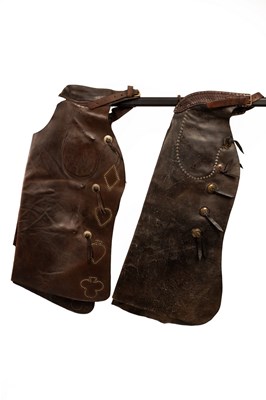 Lot 1044 - A pair of leather Western chaps decorated with...