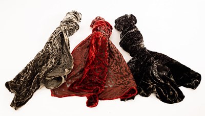 Lot 13 - A red velvet devoré scarf, 160cm x 33cm, a...