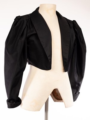 Lot 19 - Frank Usher, a short black evening jacket,...