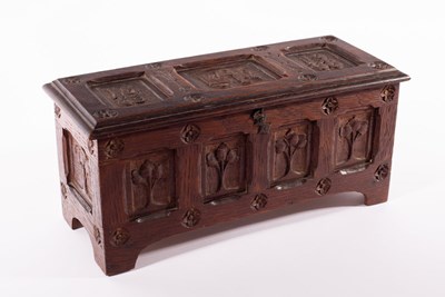 Lot 72 - An Arts & Crafts oak table casket, carved...