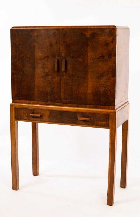 Lot 550 - Heals, a 1930s Art Deco walnut cocktail...
