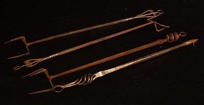 Lot 552 - Four Arts & Crafts wrought iron fire irons,...