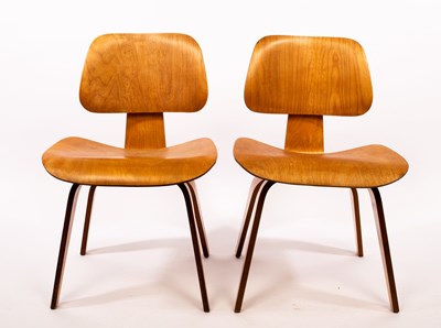 Lot 576 - Charles and Ray Eames, two DCW plywood chairs,...