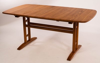 Lot 578 - Ercol, a light elm extending dining table, the...