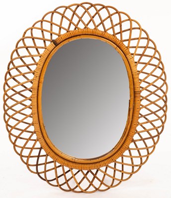Lot 587 - Style of Franco Albini, a canework oval mirror,...