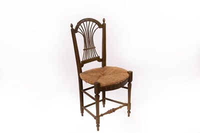 Lot 614 - An Arts & Crafts rush seat chair, in the style...