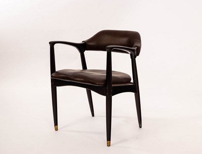Lot 623 - An open armchair in the manner of Jean Prouvé...